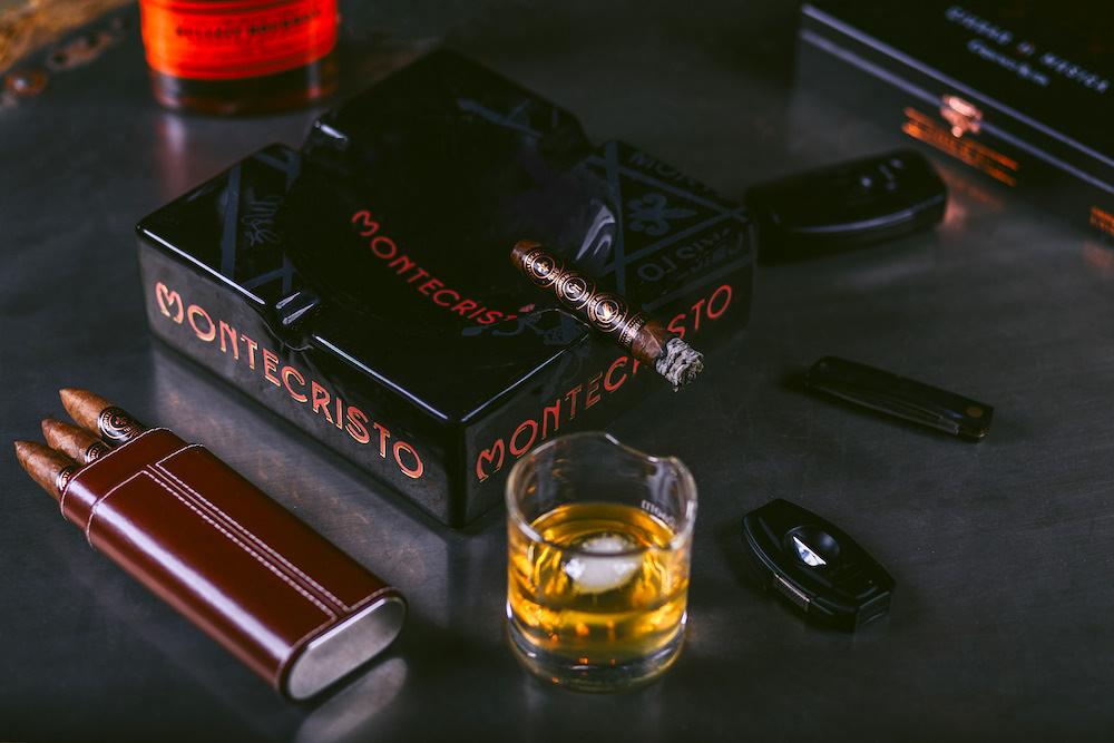 Expensive and refined habits - seasoned whiskey and elite cigars