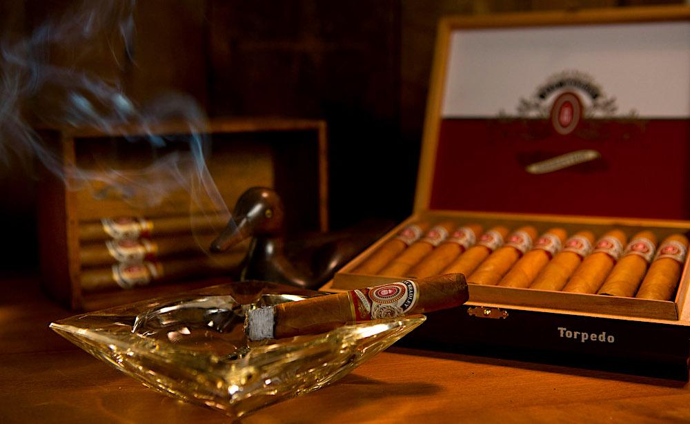 Expensive and refined habits - seasoned whiskey and elite cigars